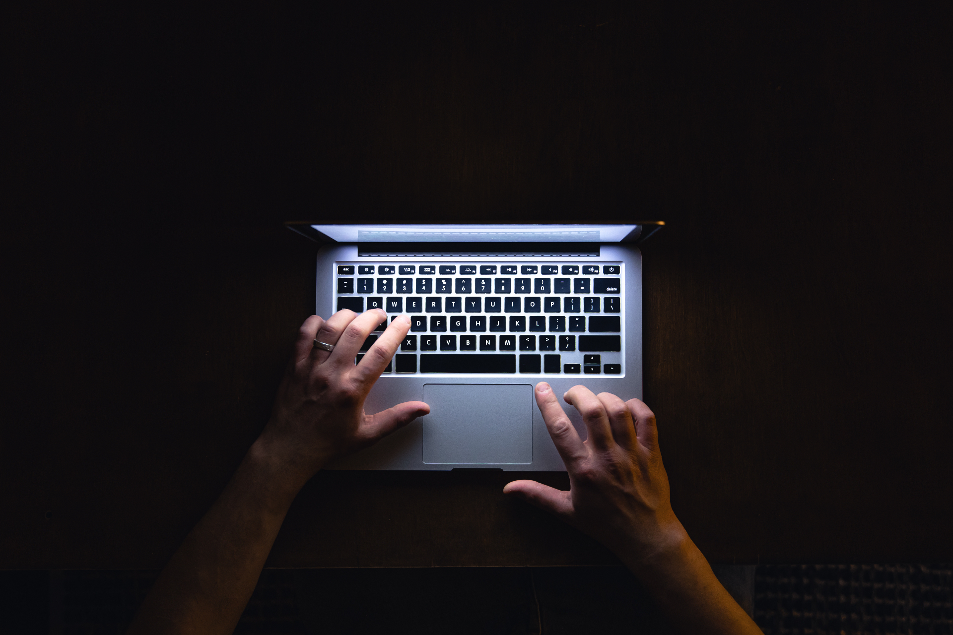 SEO content writing on laptop at night